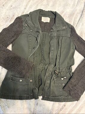 Ashley Graham olive green utility jacket with knit sleeves
